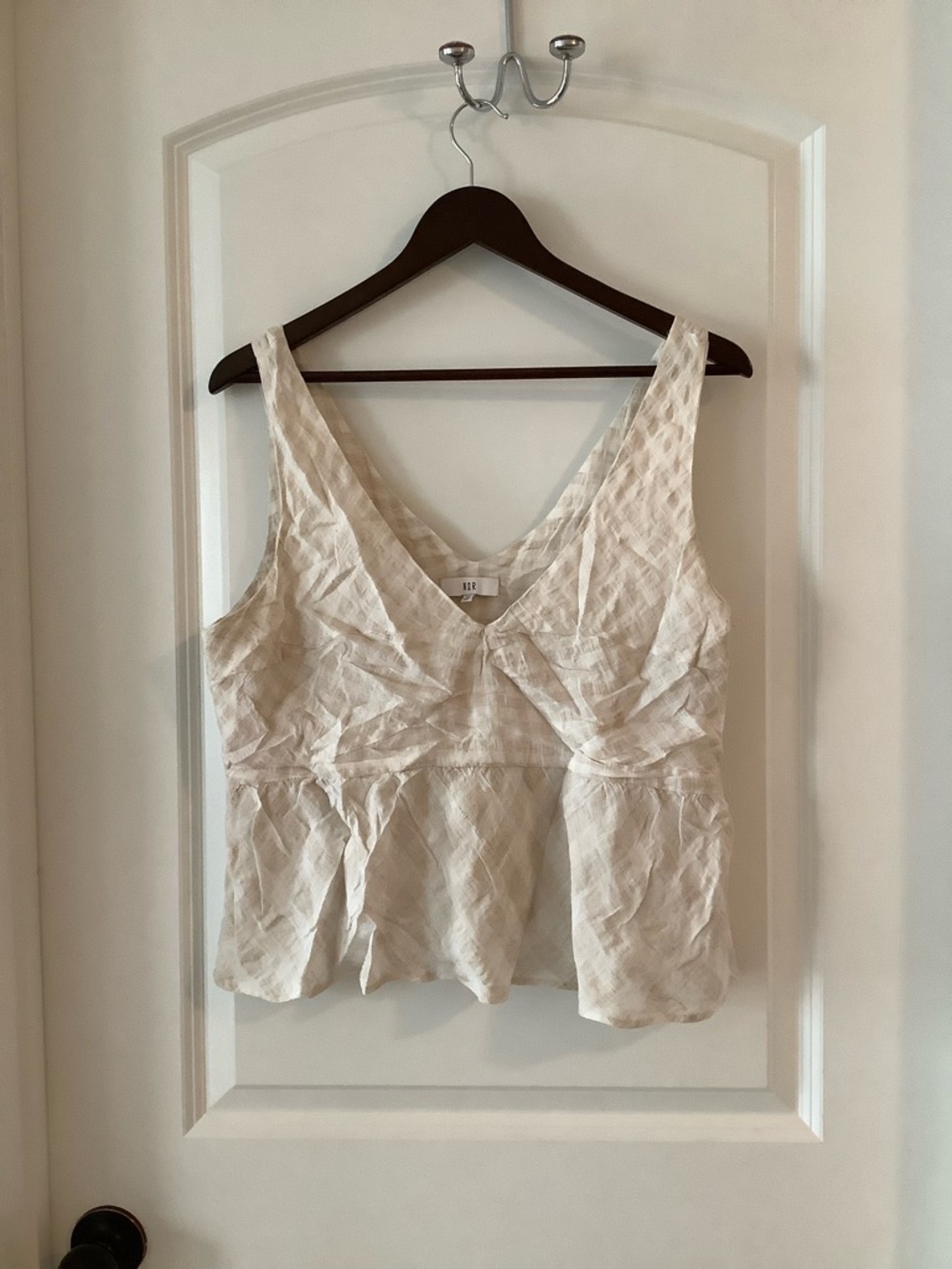 NSR Light Cream V-Neck Peplum Camisole
